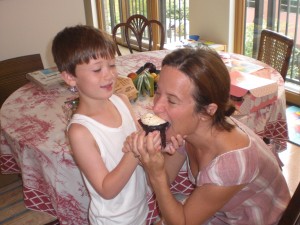 Flawless Founder, Janine Francolini sharing a birthday cupcake with her son Ellis